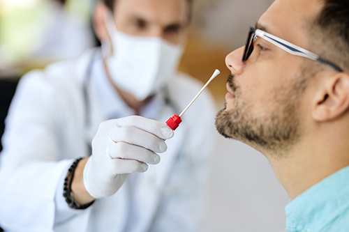 Close-up of young man getting PCR test at doctor's office during coronavirus epidemic. ; Shutterstock ID 1808630479; Purchase Order: SS-62; Job: SS-62; Client/Licensee: Vision Branding; Other: Alberto